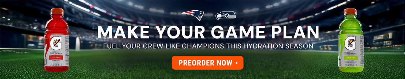 Wide stadium banner with a football field background featuring a red fruit punch sports drink bottle on the left and a green lemon lime sports drink bottle on the right, headline text reading “Make Your Game Plan,” subtext about fueling crews like champio
